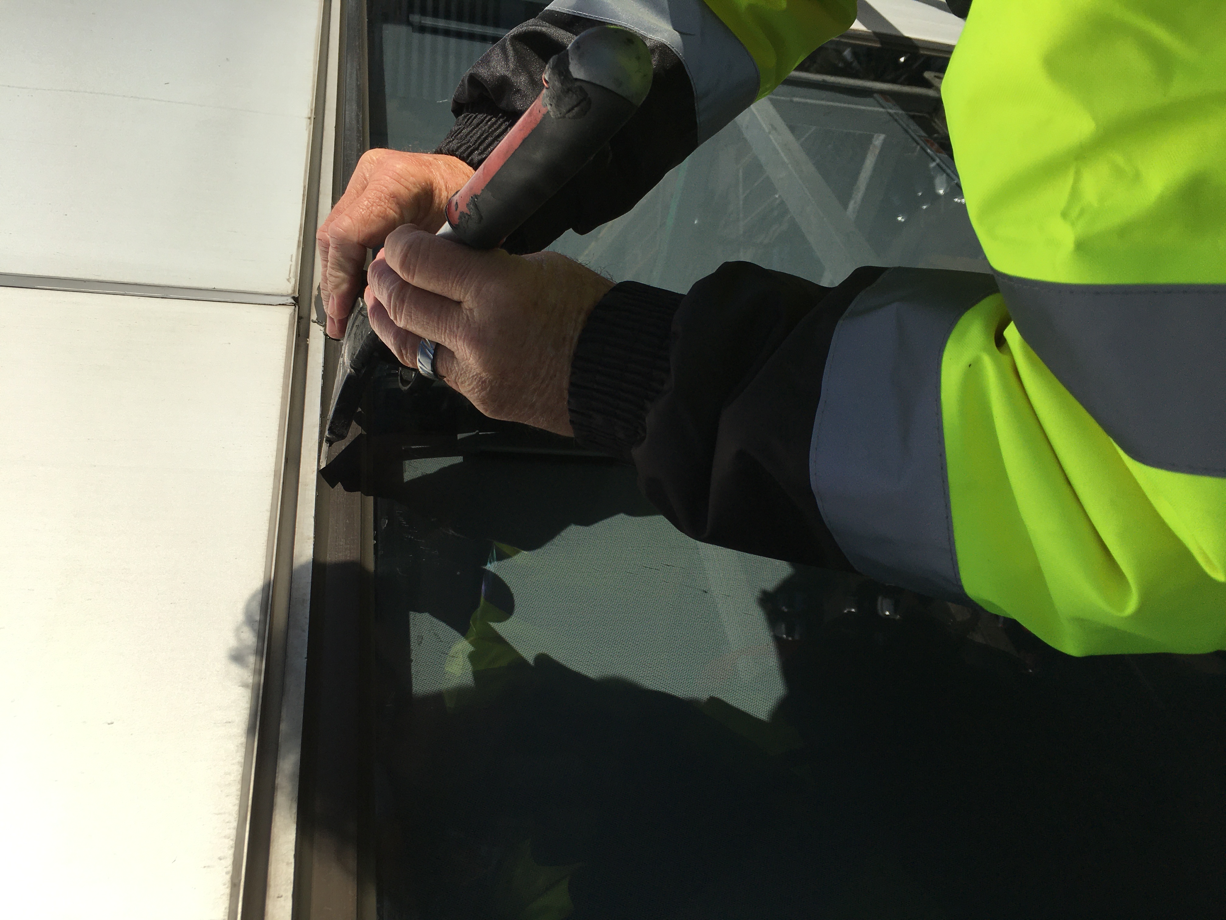 Commercial window sealant failure documented during forensic analysis in Florida