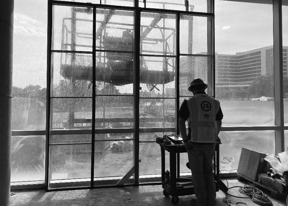 ASTM E1105 spray rack water intrusion testing on exterior window in Florida