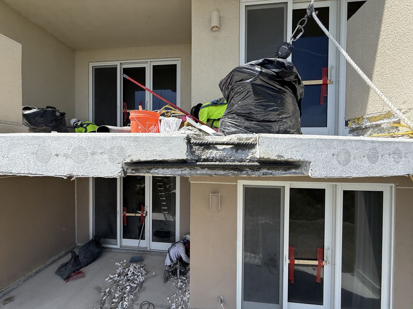 Balcony slab edge demolition and concrete restoration in progress at Ocean Place Condominiums