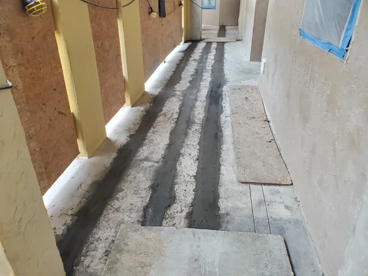 Concrete repairs along the walkway, before the new topping and finish.
