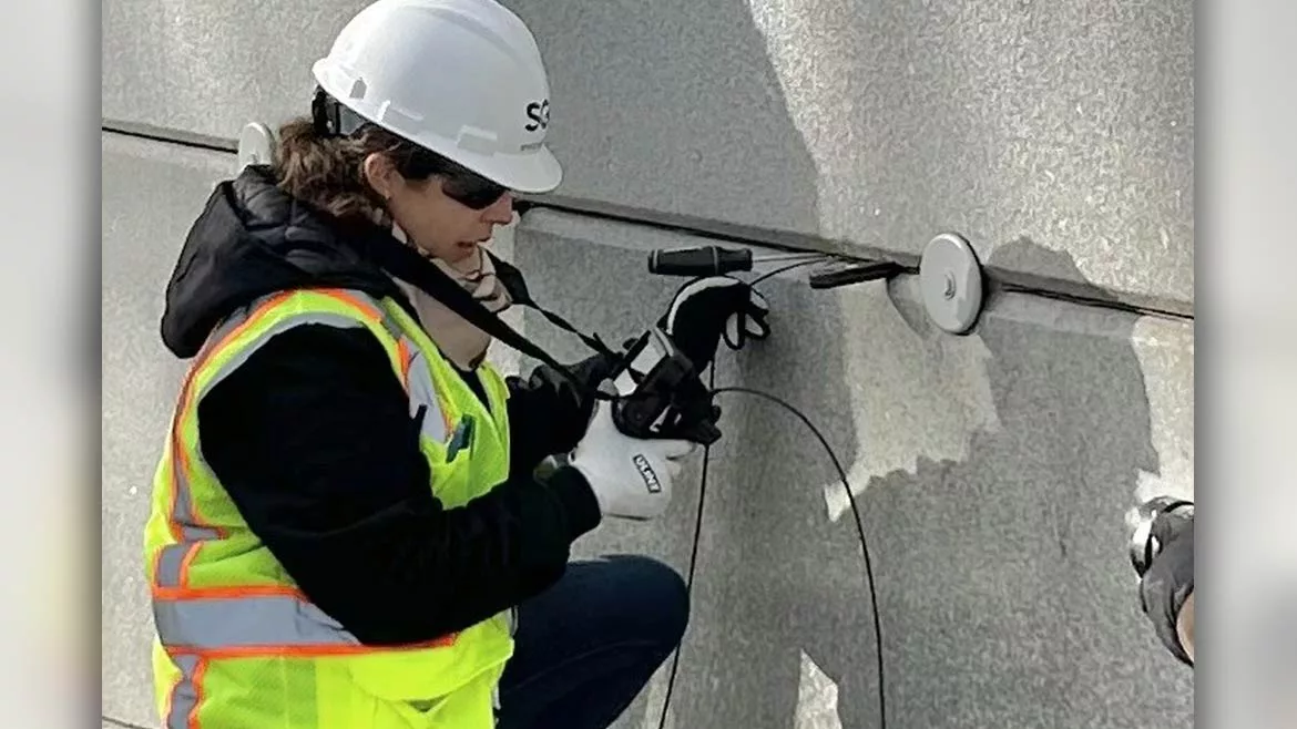 Engineer performing moisture testing on stucco exterior wall in Florida