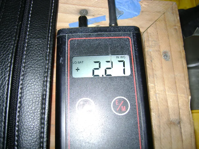 Digital manometer displaying a pressure reading of 2.27 inches of water column